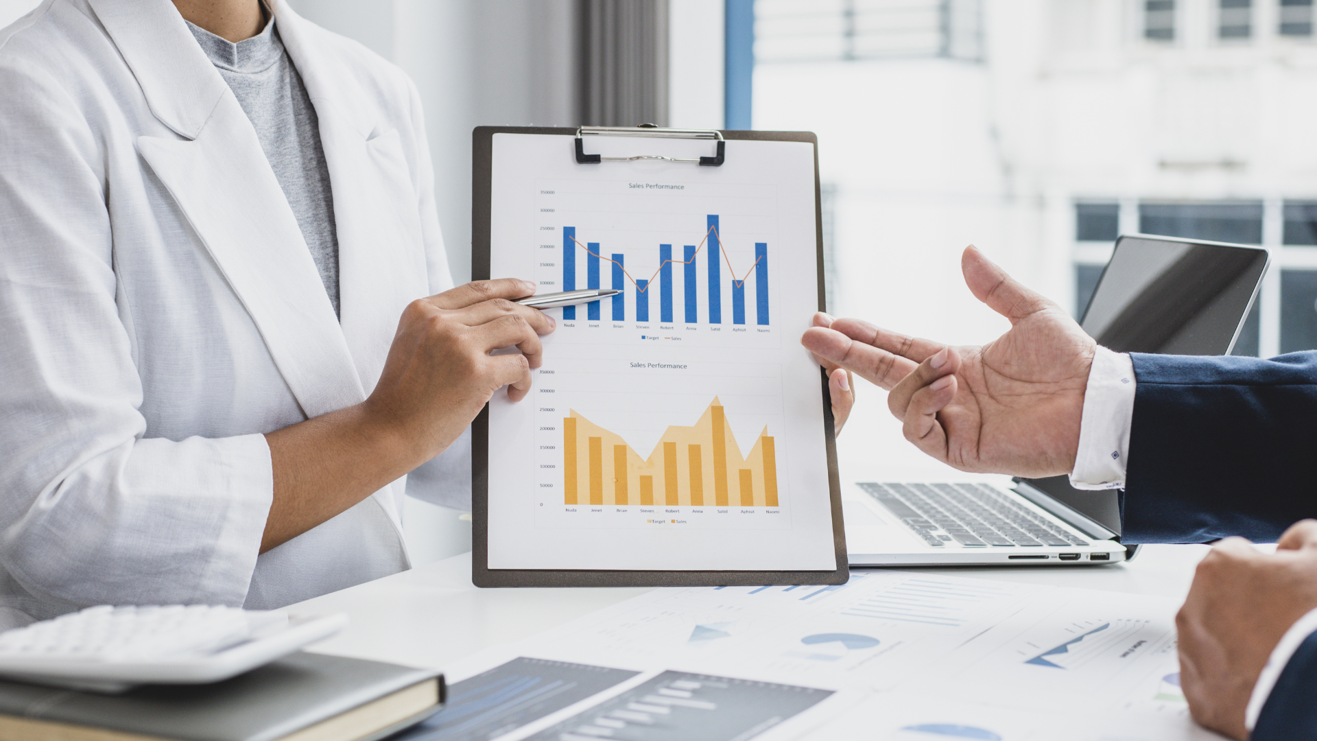 Data charts printed and reviewed on a table