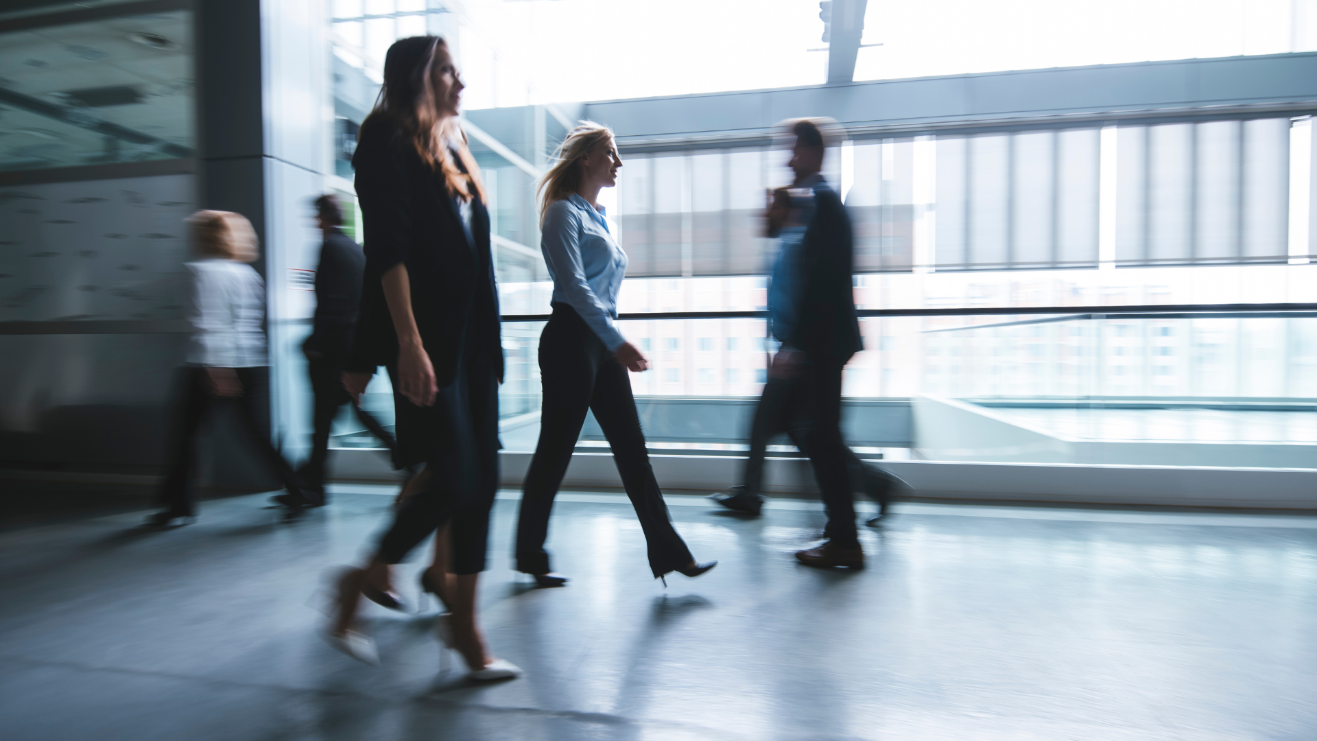 Consultants pairing in front of a whiteboard with system maps